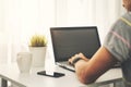 Freelance programmer programming new website on laptop