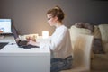 Freelance and remote work. Home office, a young professional woman, stayed at home and works online. Royalty Free Stock Photo