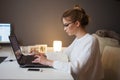 Freelance and remote work. Home office, a young professional woman, stayed at home and works online. Royalty Free Stock Photo