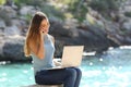 Freelance woman working in vacation on the phone