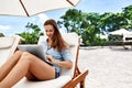 Freelance Work. Business Woman Using Computer On Beach. Online Work Royalty Free Stock Photo