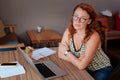 Freelance writer enjoying her break in cafe
