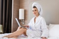 Freelancer in bathrobe and towel using