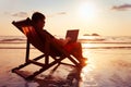 Freelancer business man working on computer in beach office, freelance job Royalty Free Stock Photo