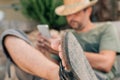 Freelancer and digital nomad working on smartphone during summer vacation holiday Royalty Free Stock Photo