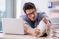 The freelancer with foot injury working from home Royalty Free Stock Photo