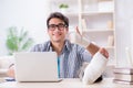 The freelancer with foot injury working from home Royalty Free Stock Photo