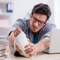Freelancer with foot injury working from home Royalty Free Stock Photo