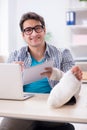 The freelancer with foot injury working from home Royalty Free Stock Photo