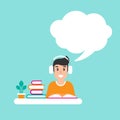 Freelancer man with earphones and speecj bubble on desk with books. creative hipster work or study at home