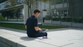 Freelancer man sitting bench street. Hispanic businessman texting laptop working Royalty Free Stock Photo