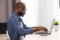 Freelancer Man Typing on Laptop Royalty Free Stock Photo