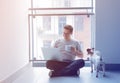 Freelancer man using laptop computer and cup of coffee Royalty Free Stock Photo