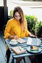 Freelancer problem challenges, Finding work, Finding clients. Freelancer woman working with laptop and writing question Royalty Free Stock Photo