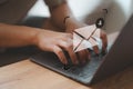 Freelancer's hand using a computer laptop and sending online message with email icon. Royalty Free Stock Photo