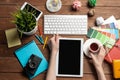 Freelancer sitting at desk and tablet computer Royalty Free Stock Photo