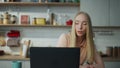 Freelancer taking online courses at laptop making notes closeup. Girl working. Royalty Free Stock Photo