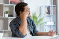 Freelancer is thinking idea or trying to solve a problem. A man is working on his laptop. Royalty Free Stock Photo