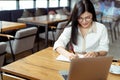 Freelancer woman listing customer receive order her using laptop computer