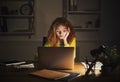 Freelancer working on laptop at home until late evening Royalty Free Stock Photo