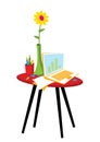 Freelancer workplace. A laptop, a vase with a flower and a cup with pencils Royalty Free Stock Photo