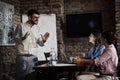 Freelancers having casual business meeting in cafe Royalty Free Stock Photo