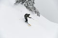 freeride male skier with go-pro camera on his helmet sliding down snow covered slope. Royalty Free Stock Photo