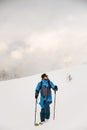 Freeride skier walking in the snow and looks away Royalty Free Stock Photo