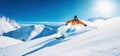 freeride skiing. skier on snowy slope against blue sky on sunny winter day. banner