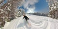 Freeride snowboard girl riding fresh powder snow in sunny mountain ski resort Royalty Free Stock Photo