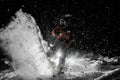 Freeride snowboarder jumping on the board in snow at night Royalty Free Stock Photo