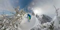 Freeride snowboarder riding fresh powder snow in snowy backcountry wilderness Royalty Free Stock Photo