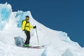 A freerider skier in complete outfit stands on a glacier in the North Caucasus Royalty Free Stock Photo