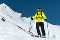 A freerider skier in complete outfit stands on a glacier in the North Caucasus Royalty Free Stock Photo