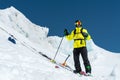 A freerider skier in complete outfit stands on a glacier in the North Caucasus Royalty Free Stock Photo