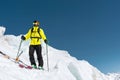 A freerider skier in complete outfit stands on a glacier in the North Caucasus Royalty Free Stock Photo