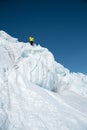 A freerider skier in complete outfit stands on a glacier in the North Caucasus. Skier preparing before jumping from the Royalty Free Stock Photo