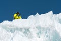 A freerider skier in complete outfit stands on a glacier in the North Caucasus. Skier preparing before jumping from the Royalty Free Stock Photo