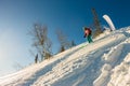 Freerider skier descends from the mountain in the light of the m