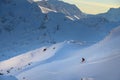 Freerider skier down the powder snow at sunset, italian alps. Skier at ski resort off-piste, colorful winter sunset