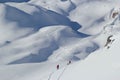 Freeriders on the rocky slopes of Elbrus in the sunny winter day