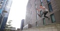Freerunner jumping between walls