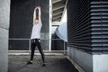 Freerunner Stretching on a Rooftop Royalty Free Stock Photo