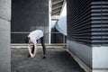 Freerunner Stretching on a Rooftop Royalty Free Stock Photo
