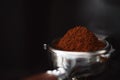 Freesh ground coffee in portafilter from grinder Royalty Free Stock Photo