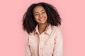 Freestyle. African girl in denim jacket standing isolated on pink smiling cheerful Royalty Free Stock Photo