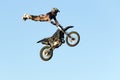 Freestyle motocross rider performs the trick in jump at fmx competitions Royalty Free Stock Photo