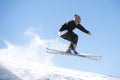 Freestyle ski jumper with crossed skis Royalty Free Stock Photo