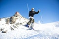 Freestyle ski jumper with crossed skis Royalty Free Stock Photo