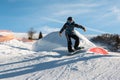 Freestyle snowboarder with helmet in snowpark Royalty Free Stock Photo